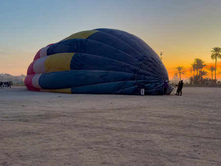 Experience the wonders of ancient Egypt from a bird's-eye view as you soar over the Nile River and the Valley of the Kings in a majestic hot air balloon.の写真素材