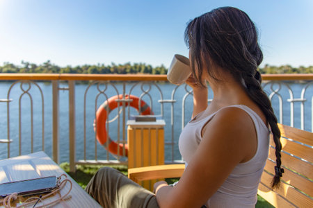 Tourist embarking on a sun-drenched Nile cruise and experiencing the perfect blend of coffee culture...