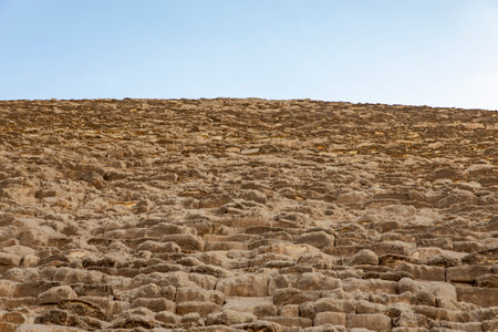 Marvel at the stones forming the Great Pyramid of Cheops in Giza, Egypt, a modern world wonder....