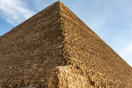 Witness the Great Pyramid of Cheops on the Giza Plateau, Egypt, one of the Seven Wonders of the Ancient World. Explore its history and architectural marvels.の写真素材