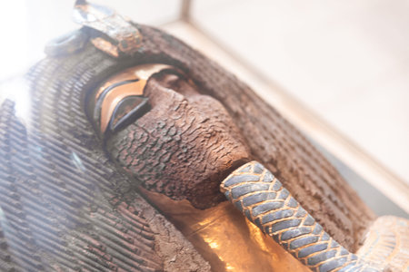 Close-up detail of an ancient Egyptian funerary coffin displayed inside the Egyptian Museum in...