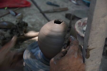Making clay pots in the yard