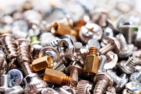 Computer screws background, hardware, bolts, nuts, selective focusの写真素材