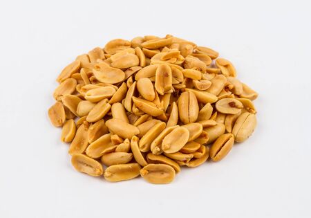 Salt roasted peanuts on a white background