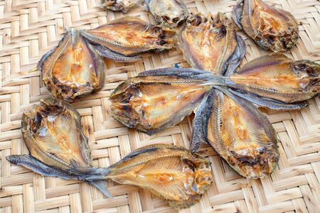 Dried fish for cooking on bamboo tray. rustic styleの写真素材
