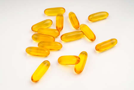 Evening primrose oil capsule on white background, supplementary food. fish oil