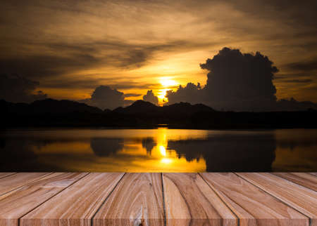 Set of empty old wooden shelf floor with river and golden sunset evening light backgroundの写真素材