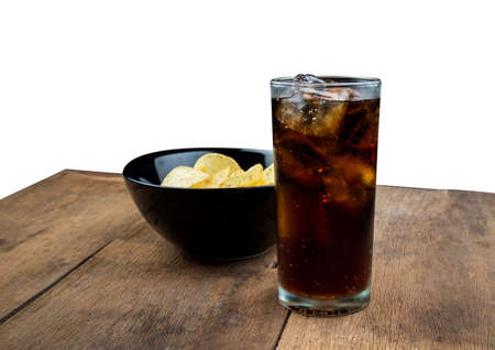 Drink cola with ice in glass in old wooden table on white backgroundの写真素材