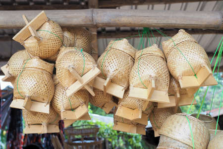 Thai traditional rice box It is called Kratib wicker container made of bamboo, for packing sticky rice.の写真素材
