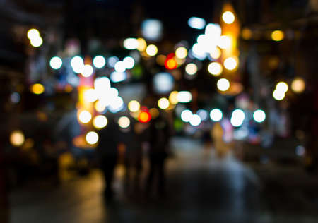 Night city street lights colorful bokeh background, darkness conceptの写真素材