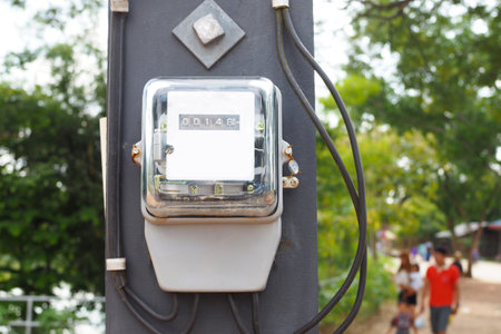 Electric meter front view on bokeh backgroundの写真素材