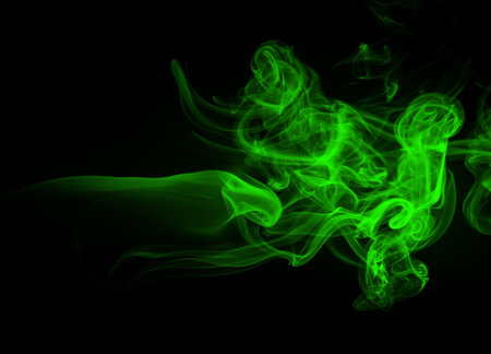 Abstract green smoke on black background, darkness conceptの写真素材