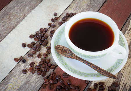 Black coffee with filter effect retro vintage style on old wooden tableの写真素材