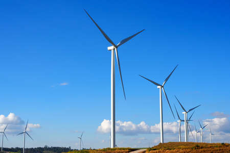 Wind turbine renewable energy source summer landscape with blue sky in natural landscapesの写真素材