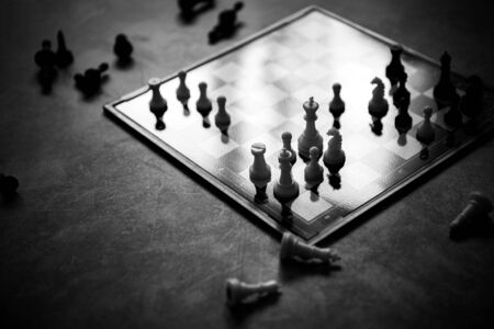 chess figures, a chess game on a modern plastic chessboardの写真素材
