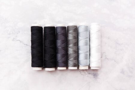 colorful sewing and tailoring tools and items on light backgroundの写真素材