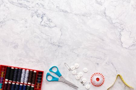 colorful sewing and tailoring tools and items on light backgroundの写真素材