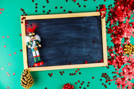 Christmas background with holiday items and a chalkboard