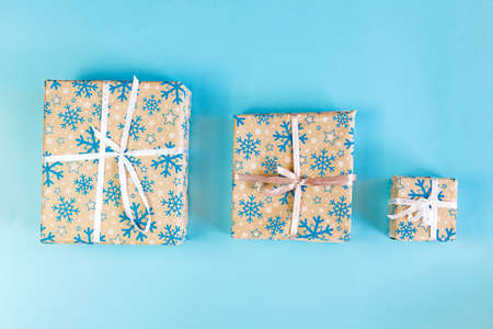 Set of cristmas boxes with ribbons and illustrations full of presents.