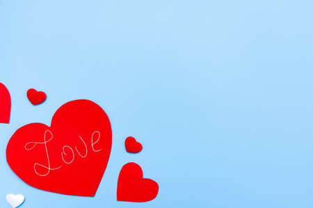 Valentine's Day background. Hearts on pastel blue background. Valentines day concept. Flat lay, top...