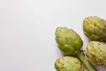 artichokes on gray background. fresh organic artichoke flowerの写真素材