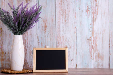 Lavender flowers in watering can, wooden background, copy spaceの写真素材