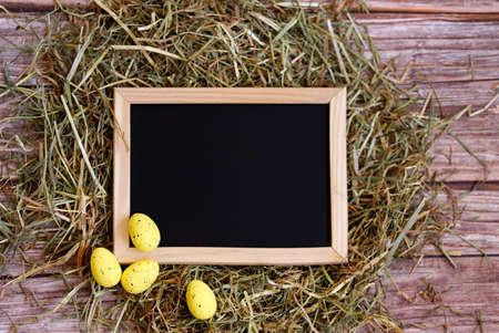 Easter concept. Rustic background with wooden frame.の写真素材
