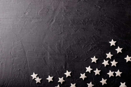 Set of white stars on black background.