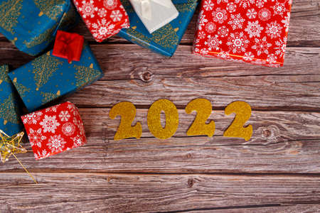 Christmas gift box on wooden table with christmas ornaments, closeup.の写真素材