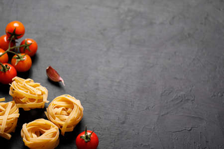 Fresh organic ingridients of italian recipes. Pasta, tomatoes, garlic. Healthy food concept.の写真素材