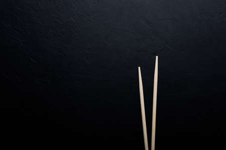 Sushi with tuna salmon rice and chopsticks on an isolated backgroundの写真素材