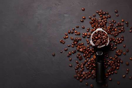 Hot fresh black coffee with milk foam for morning menu in white ceramic cup with coffee beans...