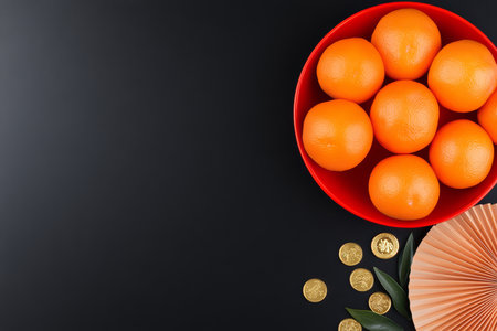 Chinese New Year 2025 Celebration Flat Lay with Gold Coins, Cherry Blossoms, and Red Fanの素材