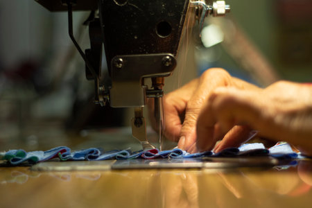 The motion of sewing machine needle bar in selective focus.の写真素材