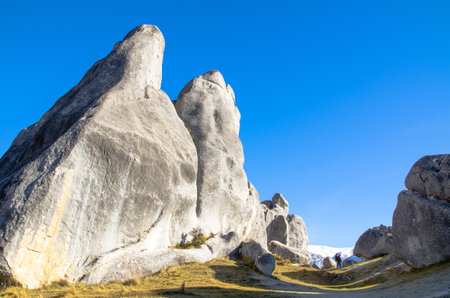 Giant rocks on the hill in New Zealand with blue sky.の写真素材