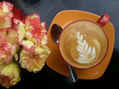 Flat white coffee art with Carnation flowers の素材