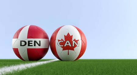 Denmark vs. Canada Soccer Match - Soccer balls in Denmark and Canada national colors on a soccer field. Copy space on the right side - 3D Renderingの写真素材