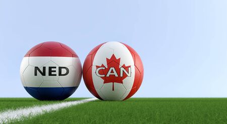 Netherlands vs. Canada Soccer Match - Soccer balls in Netherland and Canada national colors on a soccer field. Copy space on the right side - 3D Renderingの写真素材