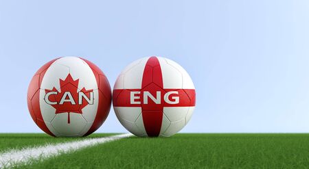 England vs. Canada Soccer Match - Soccer balls in England and Canada national colors on a soccer field. Copy space on the right side - 3D Renderingの写真素材