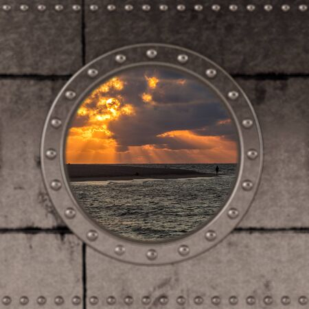 Looking through a ship Porthole on the the ocean.の写真素材