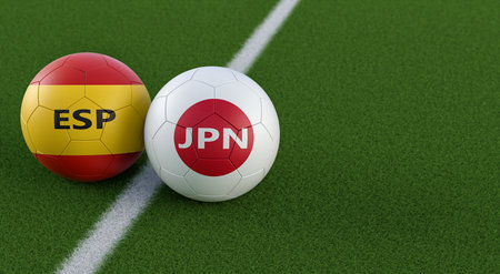 Spain vs. Japan Soccer Match - Soccer balls in Japan and Spain national colors on a soccer field. Copy space on the right side - 3D Renderingの写真素材