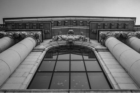 SOFIA, BULGARIA - JULY 5, 2018: It is summer already but winter Christmas decorations, Santa Claus and snowflakes, still remain on the huge windows of Sofia University. Black and white facade imageのeditorial素材
