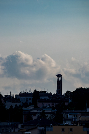Amazing sky and church silhouette view of ancient town of Matera, the Sassi di Matera, Basilicata, Southern Italy, cloudy summer afternoon just before sunsetの写真素材