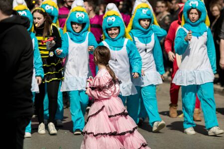 XANTHI, GREECE - MARCH 10, 2019: Masquerade participants march and have fun in colorful costumes. Small and big groups of Greek people parade annually on city streets in thematic festival outfitsのeditorial素材