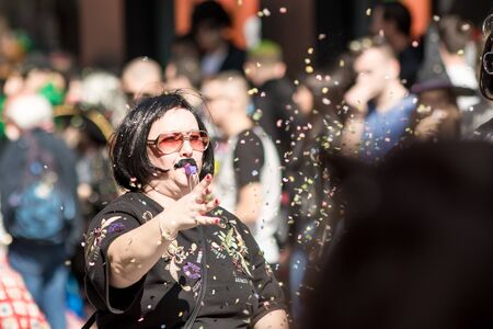 XANTHI, GREECE - MARCH 10, 2019: Masquerade participants march and have fun in colorful costumes. Small and big groups of Greek people parade annually on city streets in thematic festival outfitsのeditorial素材