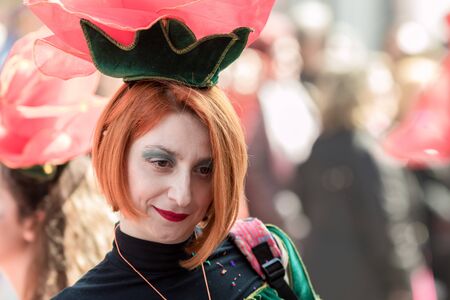 XANTHI, GREECE - MARCH 10, 2019: Masquerade participants march and have fun in colorful costumes. Small and big groups of Greek people parade annually on city streets in thematic festival outfitsのeditorial素材