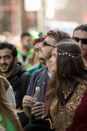 XANTHI, GREECE - MARCH 10, 2019: Masquerade participants march and have fun in colorful costumes. Small and big groups of Greek people parade annually on city streets in thematic festival outfitsのeditorial素材