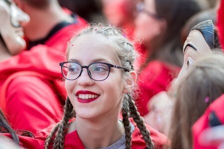 XANTHI, GREECE - MARCH 10, 2019: Masquerade participants march and have fun in colorful costumes. Small and big groups of Greek people parade annually on city streets in thematic festival outfitsのeditorial素材