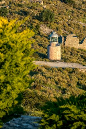 Small lighthouse powered by sun light near Lekuresi Castle, Saranda, Albania. Two photovoltaic panelsの写真素材