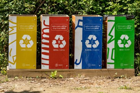 KRONGJI, ALBANIA - JUNE 7, 2019: Paper, plastic, metal and glass waste recycle bins, Blue Eye national natural park outdoors, Albania, sunny spring dayのeditorial素材